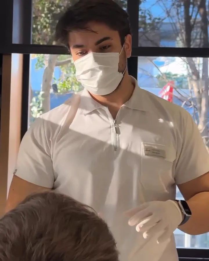 A clinician working chairside with a patient at our Istanbul clinic