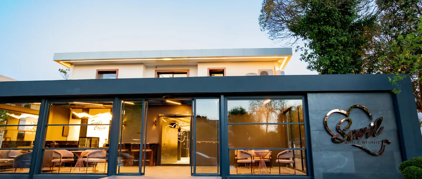 The garden-level lounge building at our Istanbul clinic at dusk