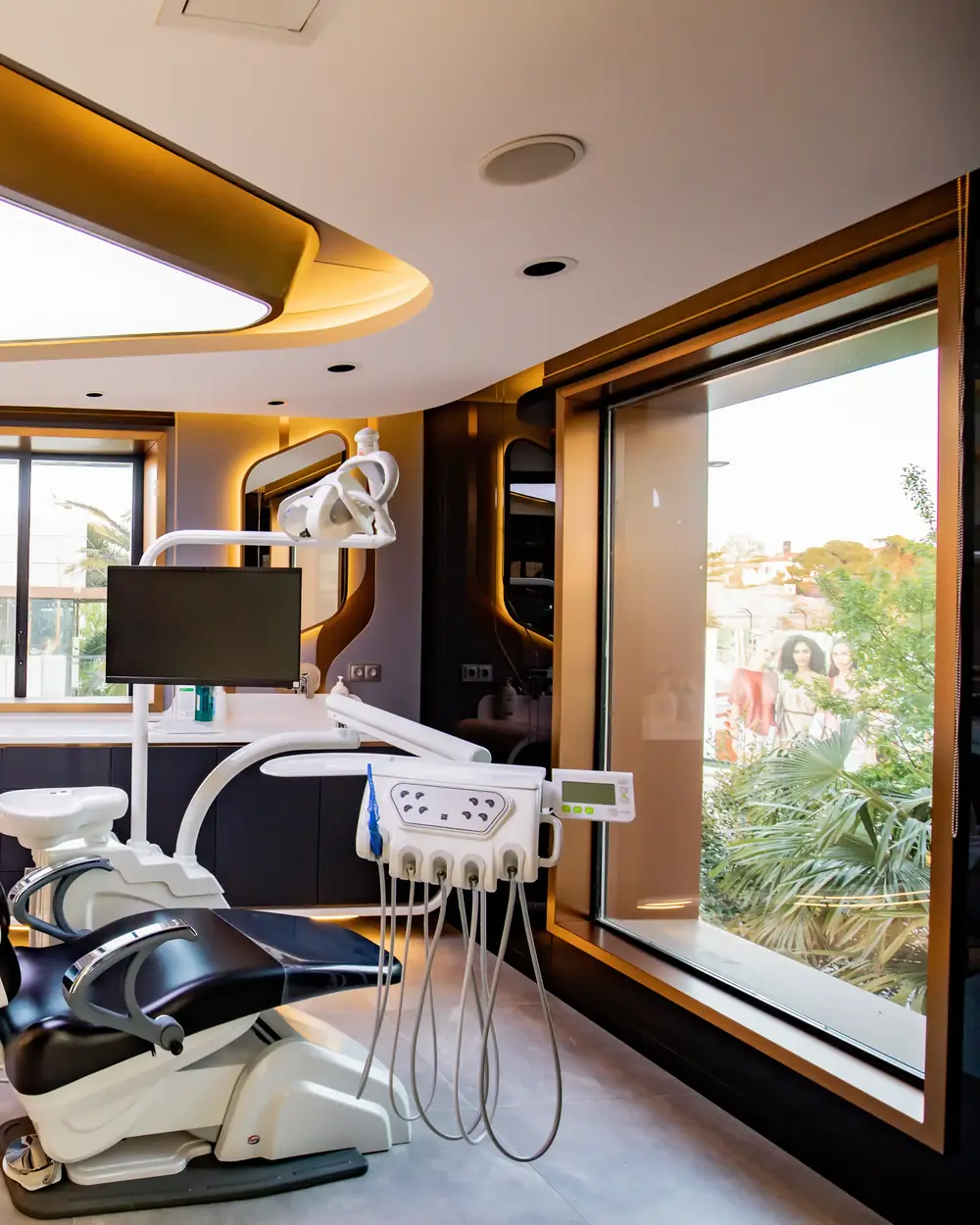 A treatment room at our Istanbul clinic, with the dentist's desk and screen beside the chair
