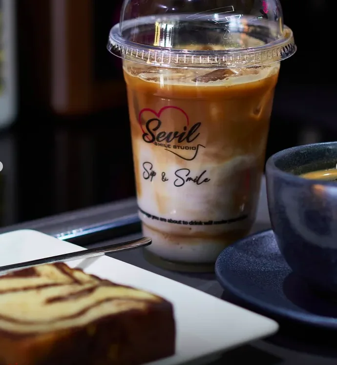 A 'Sip & Smile' drink and pastry served at the clinic